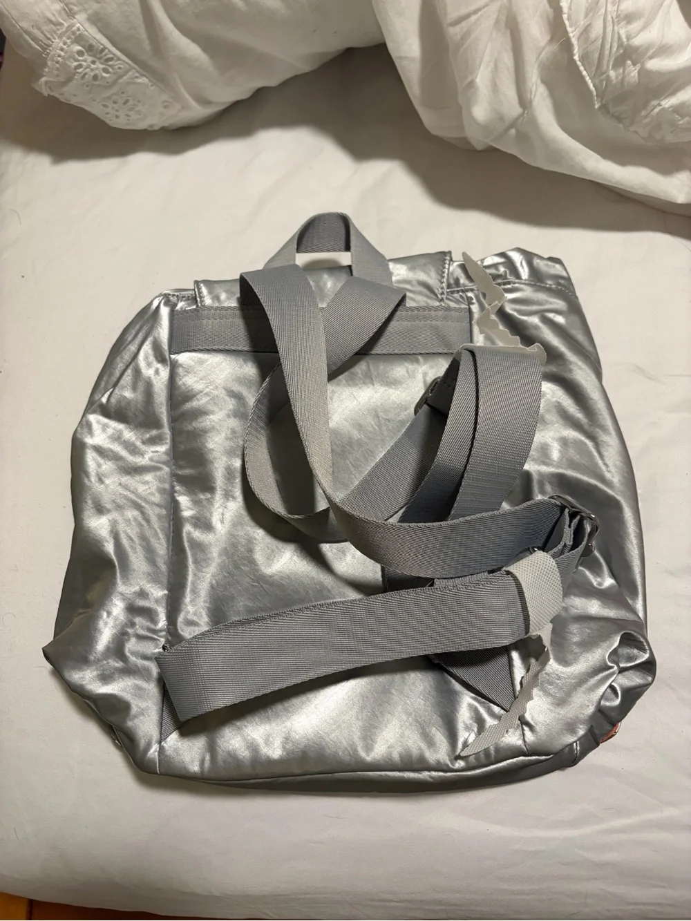 Kipling Silver Metallic Backpack with Orange lining Accent